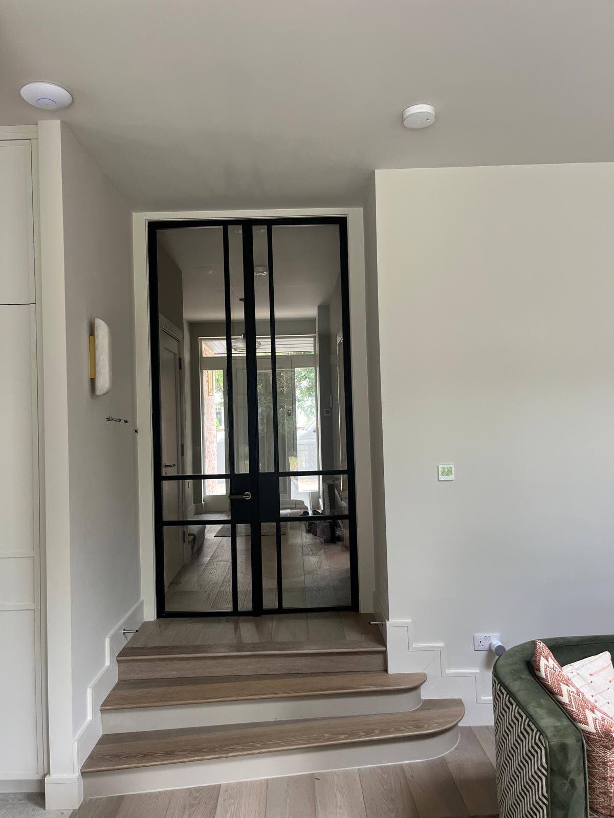 Steel-framed internal doors to the hallway