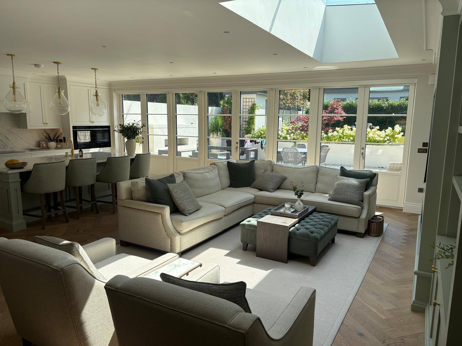 Stillorgan residence: living room with rooflights opening to the garden