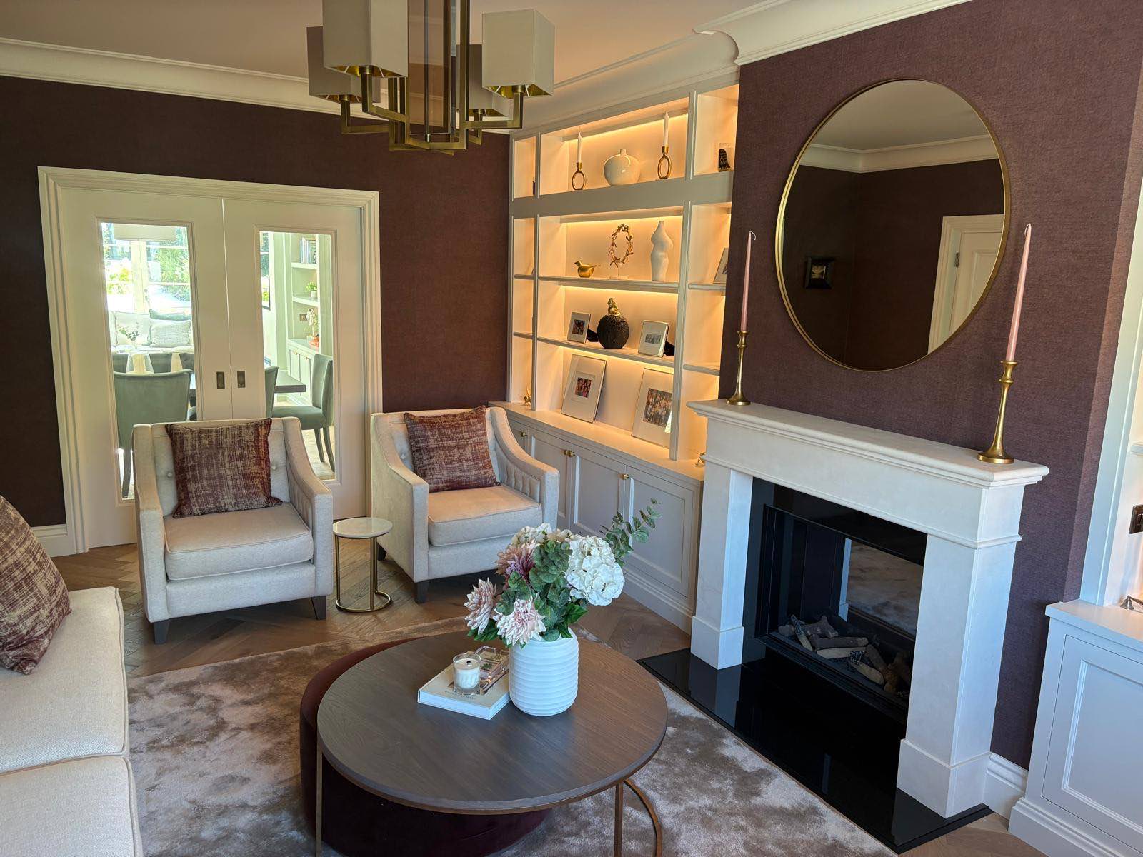 Panelled reception room with fireplace and fitted joinery