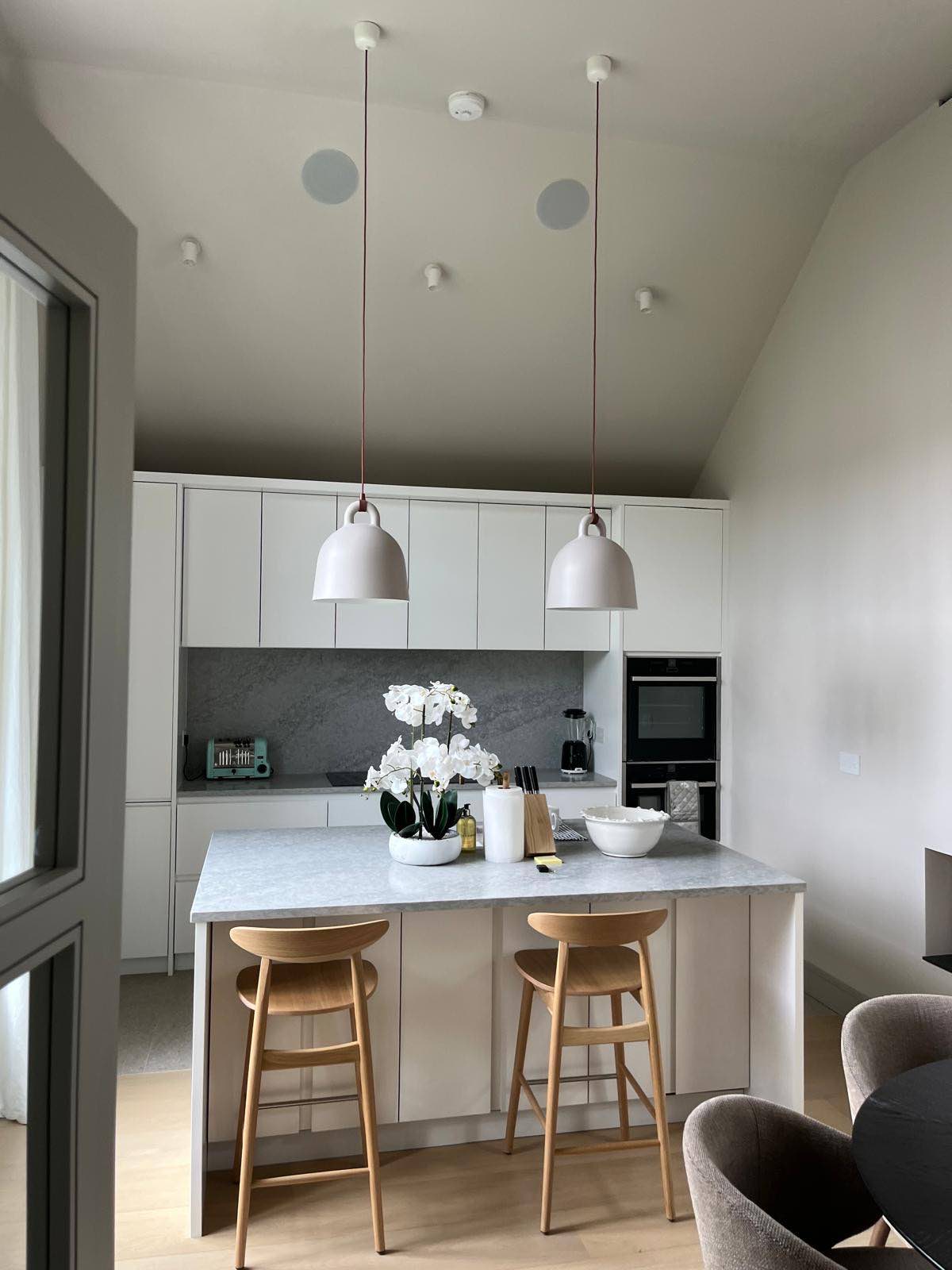 Kitchen with island beneath the pitched roof
