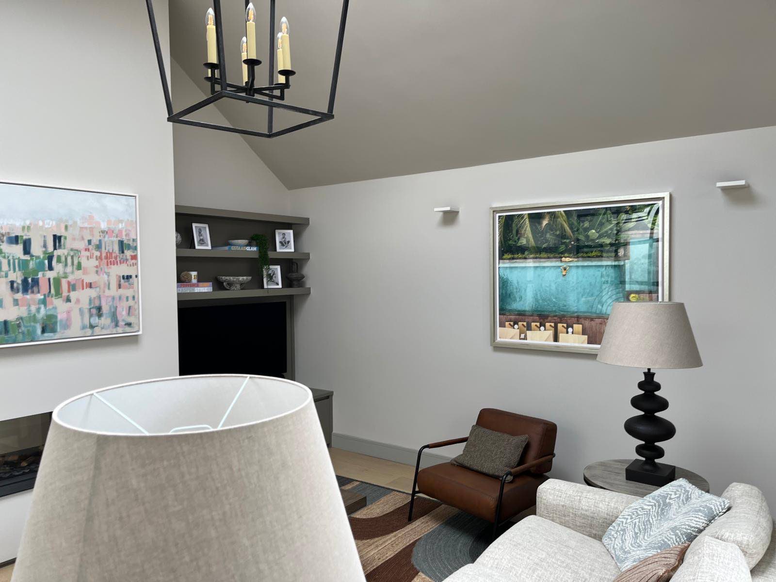 Sitting room with fitted shelving and garden outlook