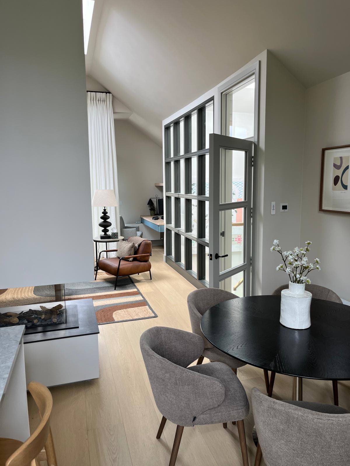 Dining area and steel-framed internal screen